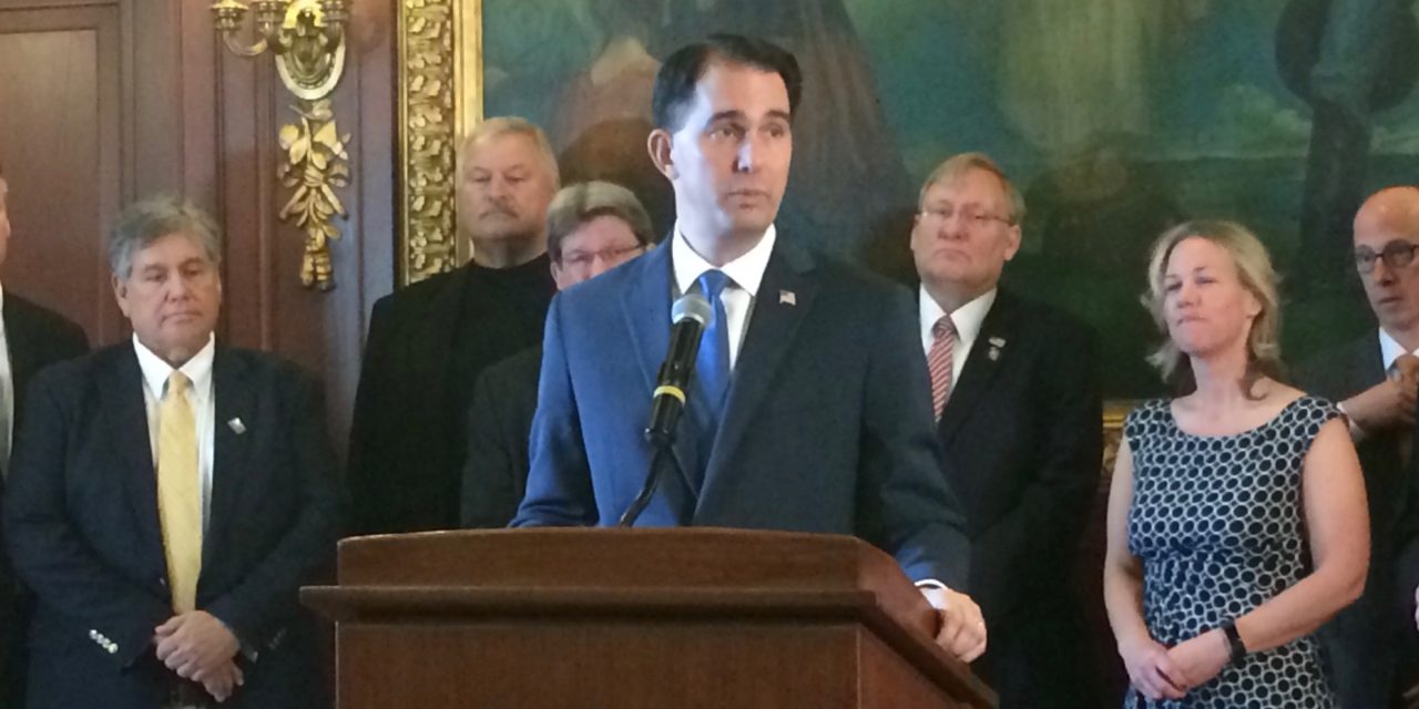 Walker vows to ensure coverage for those with pre-existing conditions